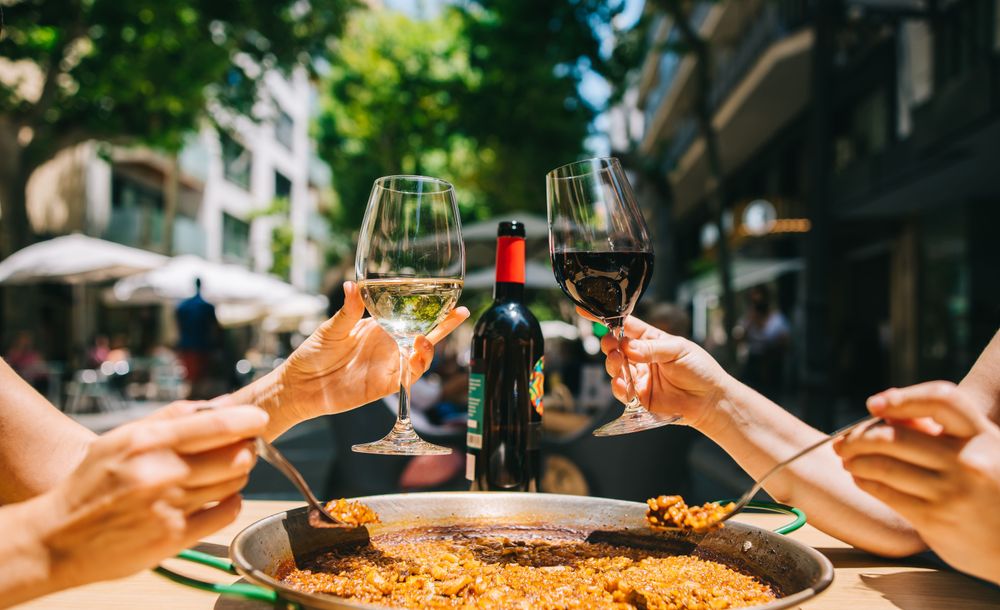 Couple enjoying the low cost of eating out in Spain